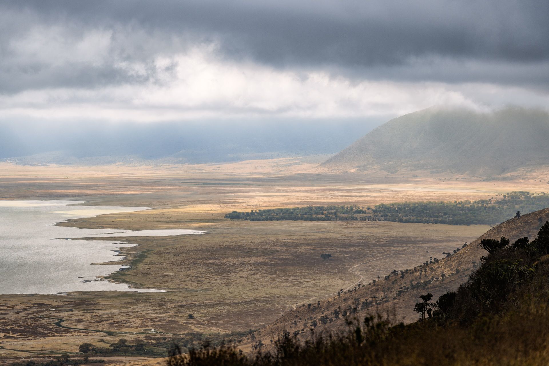Storm light over the Ngorongoro Crater floor and its soda lake, seen from the rim